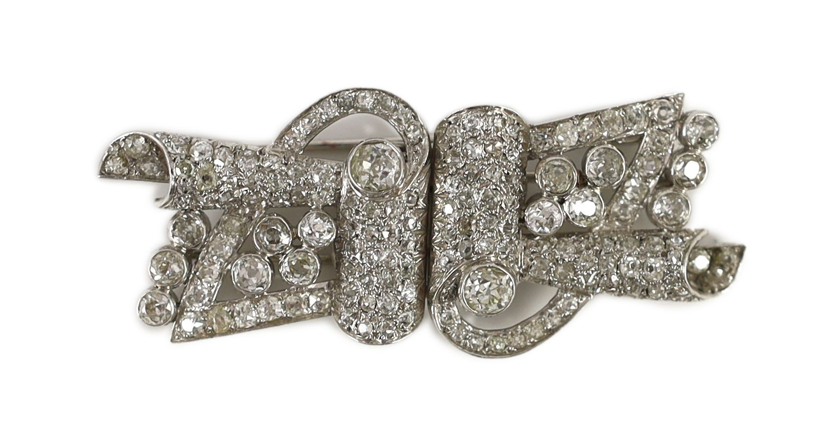 A mid 20th century Art Deco platinum and diamond cluster detachable double clip brooch